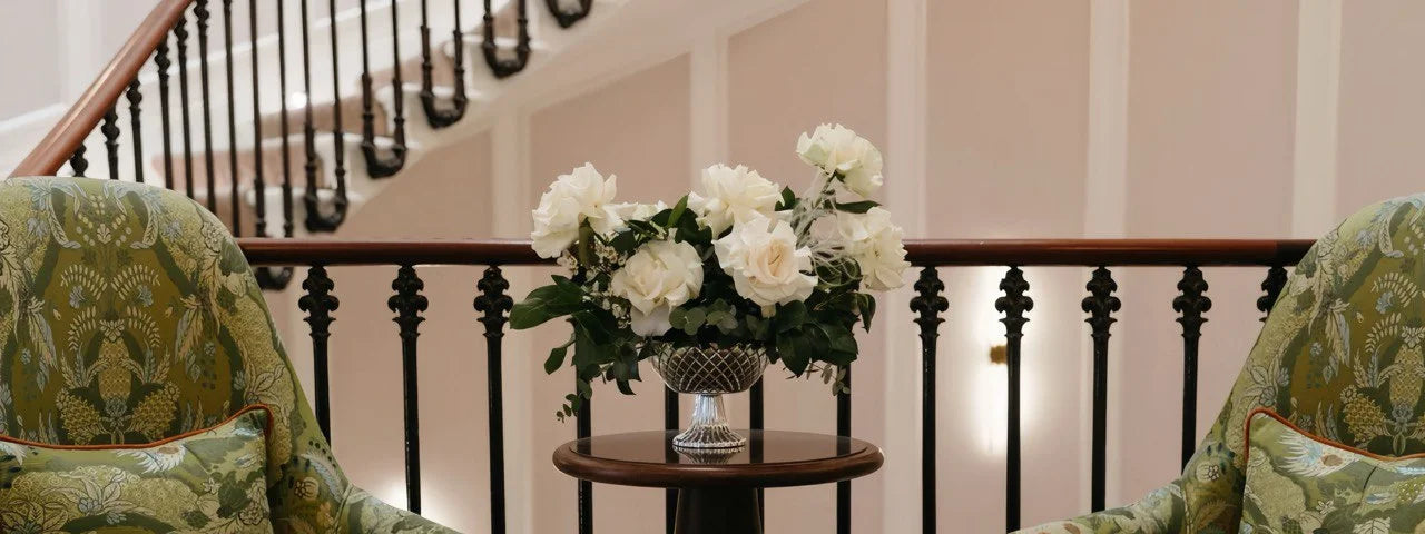 White and green wedding flower centrepiece with roses in a crystal vase at The Chesham Hotel, Belgravia — elegant floral styling by Floetica for an intimate London wedding.