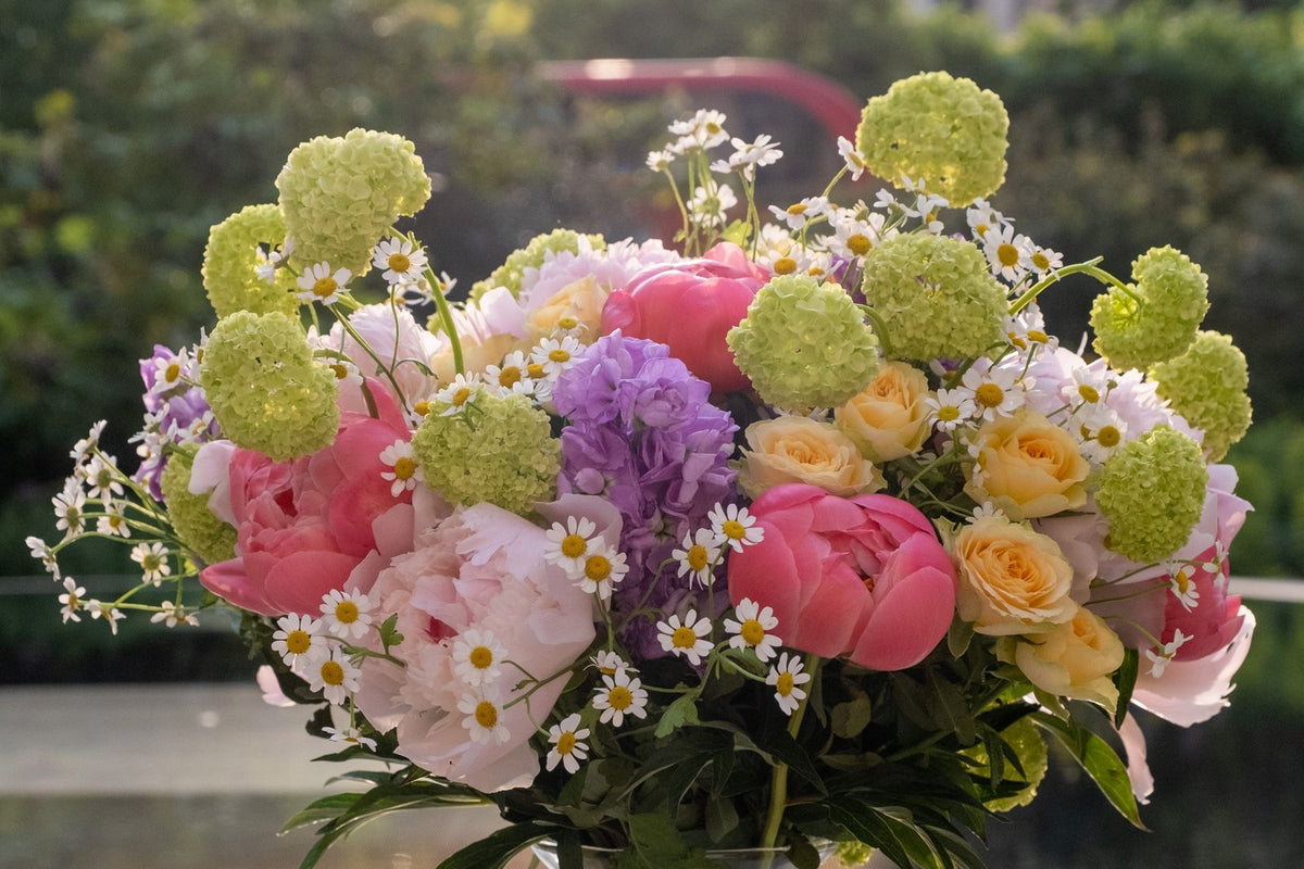 Fresh seasonal flowers in a glass vase, hand-tied by Floetica for same-day London delivery